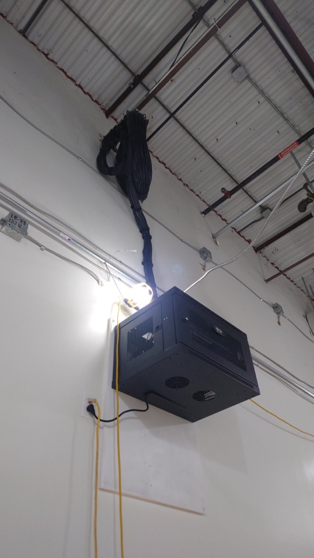 Real wall-mounted server rack installation