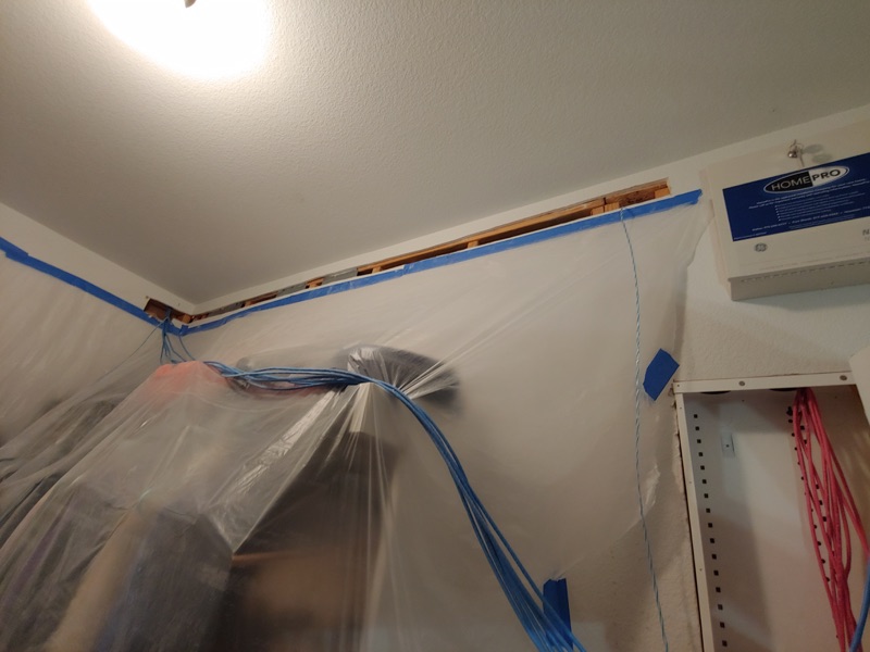 Real media closet wall opening protected for new cable runs